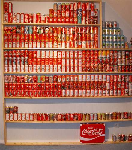 Wall of shelves displaying the Coca-Cola can collection in the early 2000s